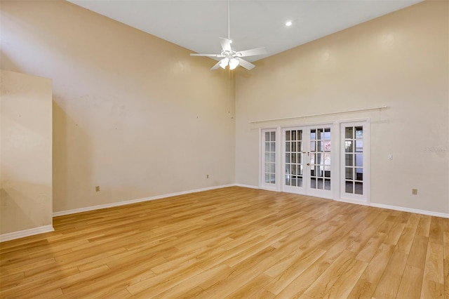 unfurnished room with light hardwood / wood-style floors, french doors, and ceiling fan