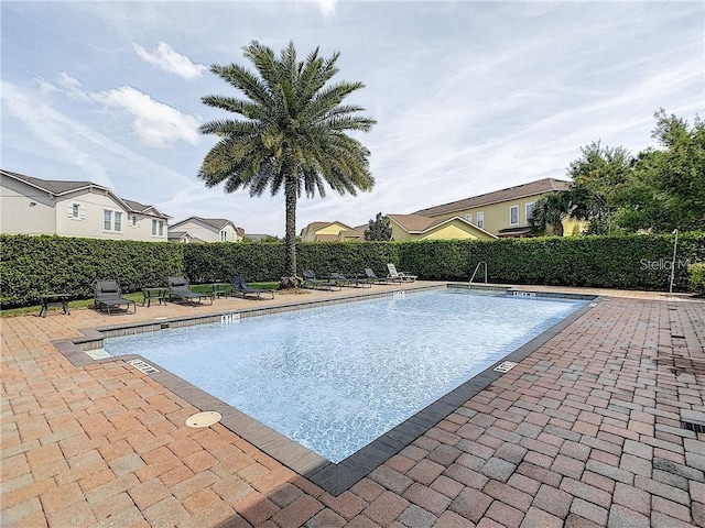 view of swimming pool featuring a patio