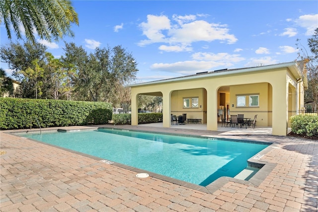 view of pool featuring a patio