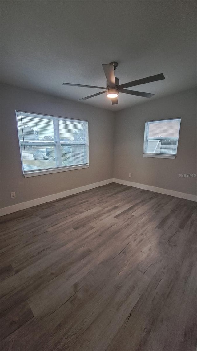 spare room featuring ceiling fan and wood-type flooring