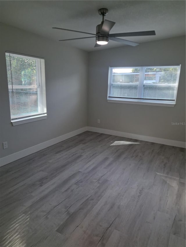 spare room featuring ceiling fan and wood-type flooring