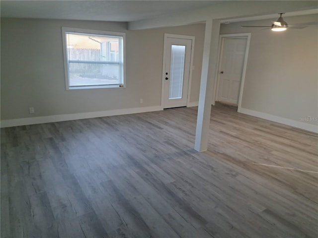 interior space featuring light hardwood / wood-style floors and ceiling fan