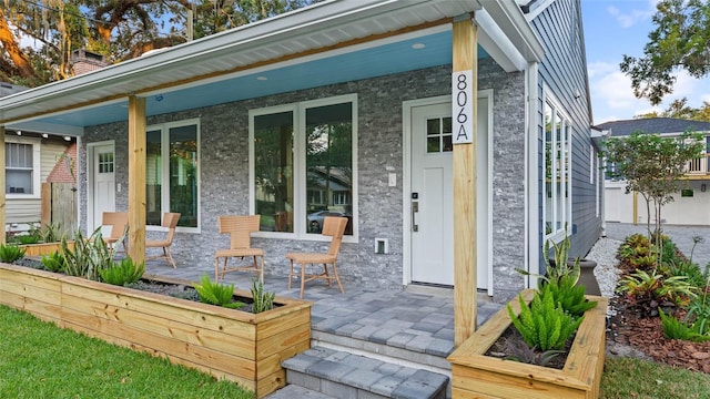 back of house with covered porch