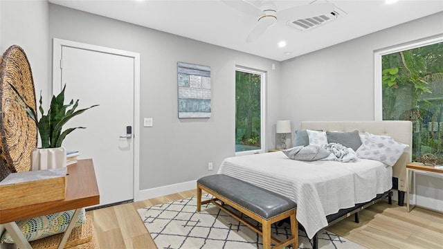 bedroom featuring ceiling fan and light hardwood / wood-style floors