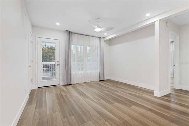 spare room featuring ceiling fan and light hardwood / wood-style floors