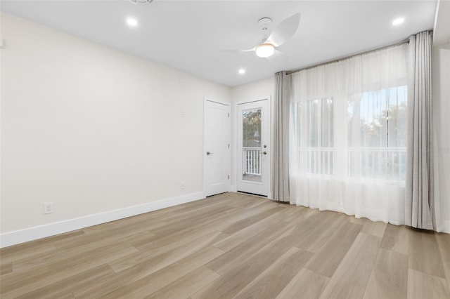 unfurnished room featuring ceiling fan and light hardwood / wood-style floors