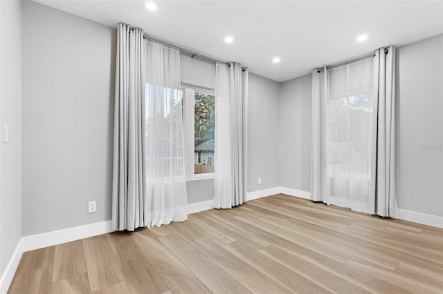 spare room with light wood-type flooring