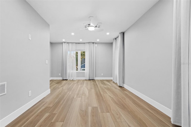 unfurnished room featuring ceiling fan and light hardwood / wood-style floors