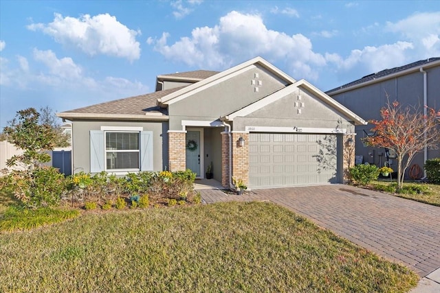 view of front facade with a garage and a front lawn