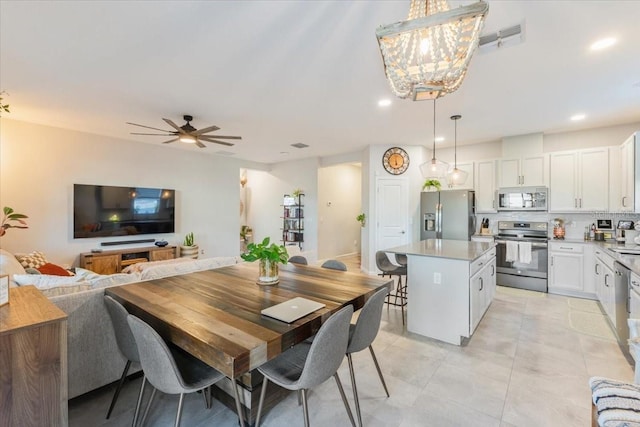 dining space with ceiling fan