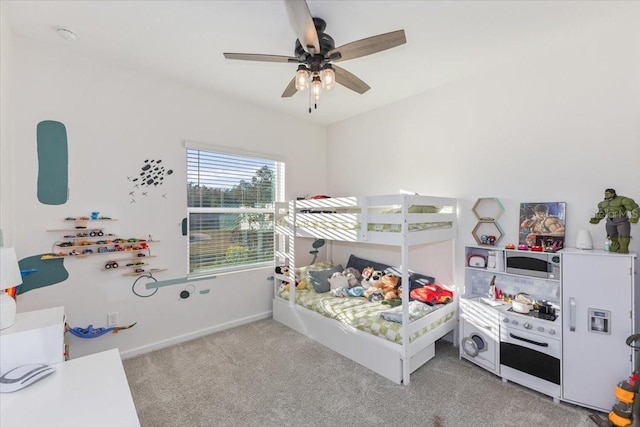 bedroom with light colored carpet and ceiling fan