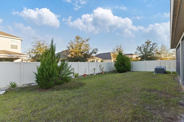 view of yard with central AC