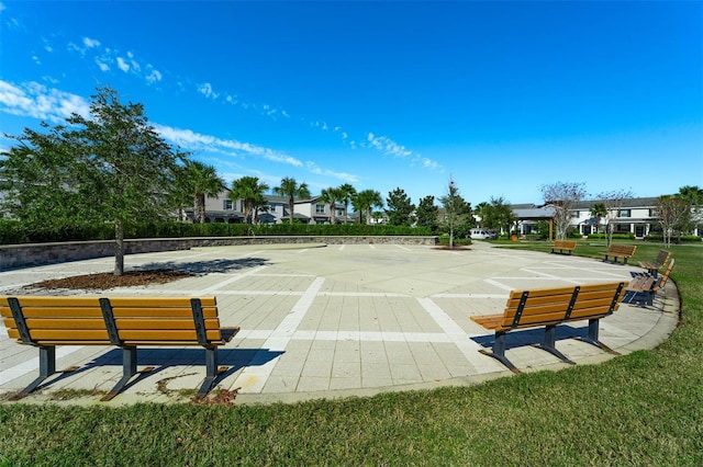 view of property's community with a lawn