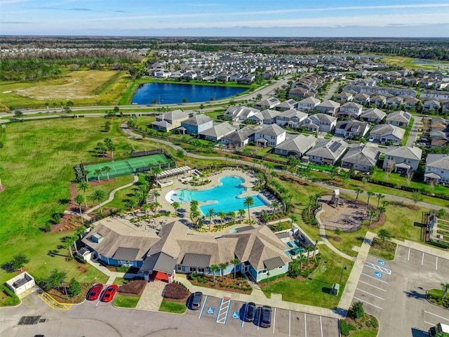 birds eye view of property with a water view