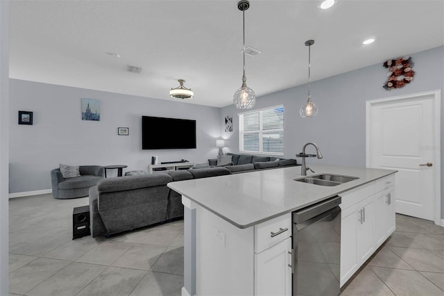 kitchen with visible vents, dishwasher, light countertops, light tile patterned flooring, and a sink