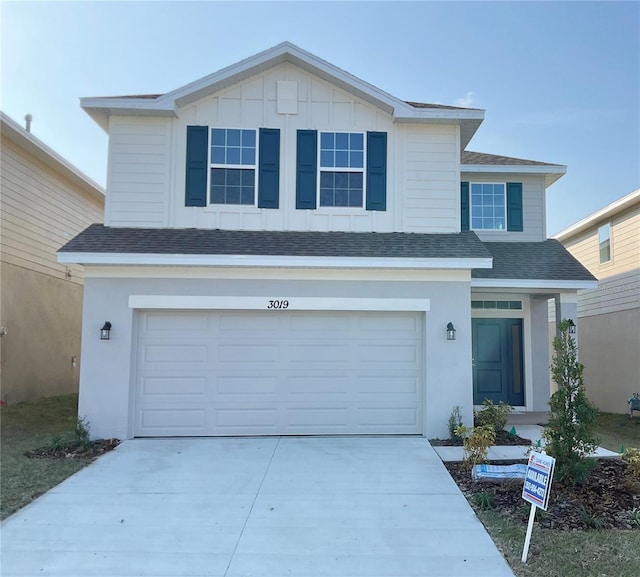 front of property with a garage