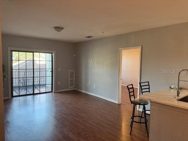 interior space with sink and dark hardwood / wood-style floors