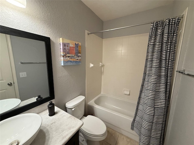 full bathroom featuring tile patterned flooring, vanity, shower / tub combo with curtain, and toilet