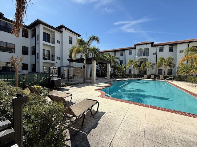 view of pool with central AC, a pergola, and a patio area