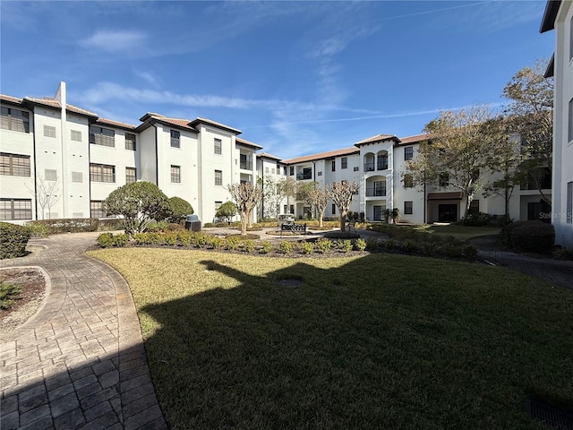 view of property's community with a yard