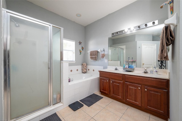 bathroom with independent shower and bath, vanity, and tile patterned floors