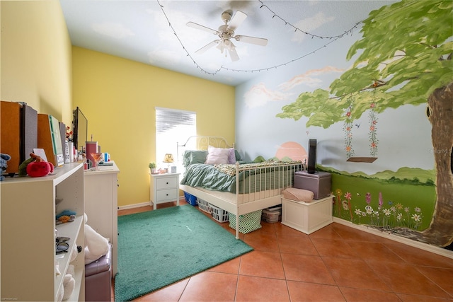 tiled bedroom featuring ceiling fan