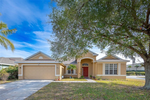 view of front of property with a garage, a front yard, driveway, and stucco siding