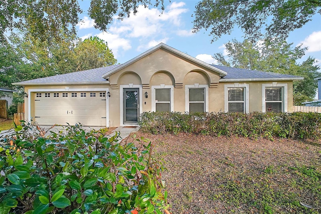 ranch-style house featuring a garage