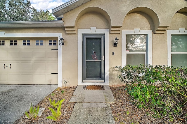 property entrance with a garage