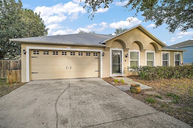 single story home featuring a garage