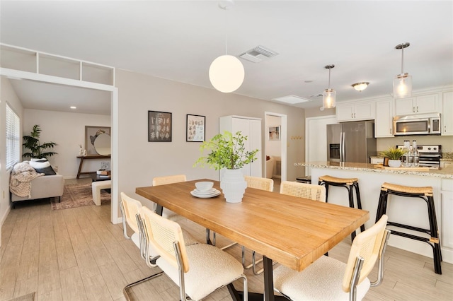 dining area featuring light hardwood / wood-style floors