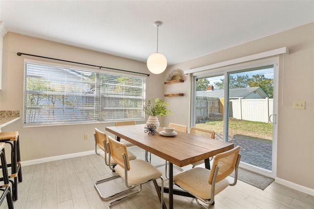 dining area with light hardwood / wood-style flooring