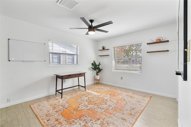 interior space with ceiling fan and light hardwood / wood-style flooring