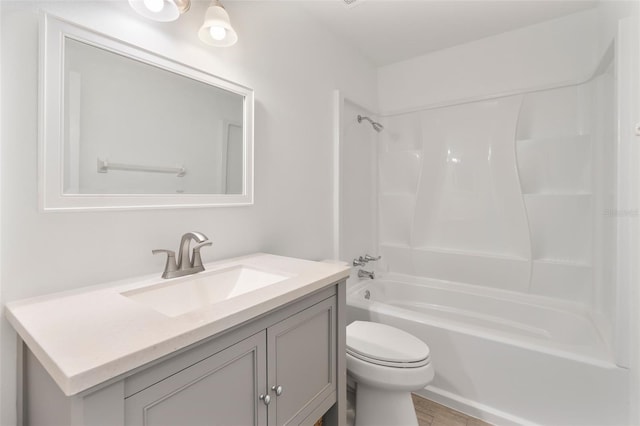 full bathroom featuring vanity, shower / tub combination, and toilet