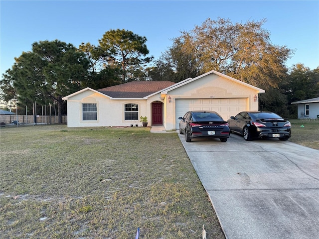 single story home with a garage and a front yard