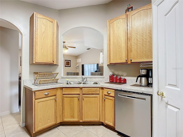 kitchen with light brown cabinetry, sink, stainless steel dishwasher, and ceiling fan