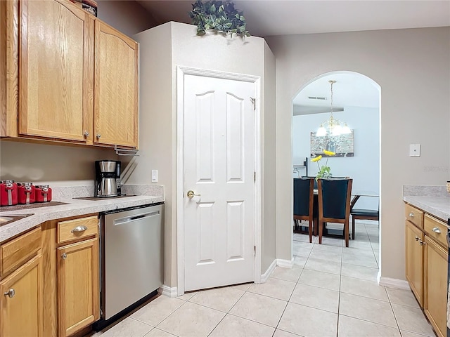 kitchen with decorative light fixtures, dishwasher, and light tile patterned floors