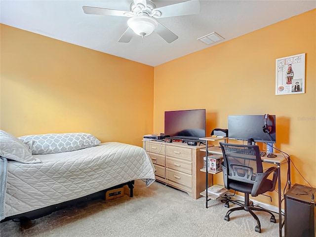 bedroom with light colored carpet and ceiling fan