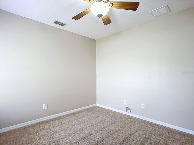 empty room featuring carpet and ceiling fan