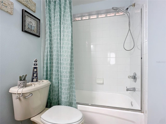 bathroom with toilet and tiled shower / bath combo