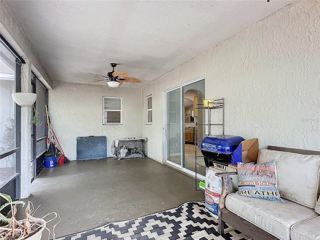 view of patio featuring ceiling fan