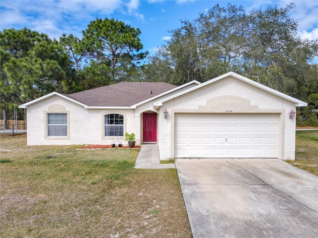 single story home featuring a garage and a front yard