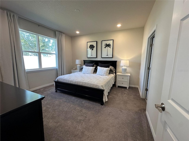 bedroom with dark carpet