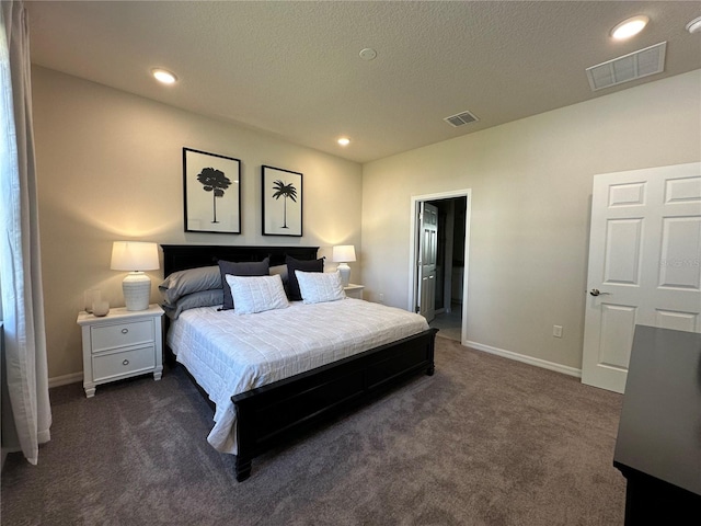 carpeted bedroom with ensuite bath