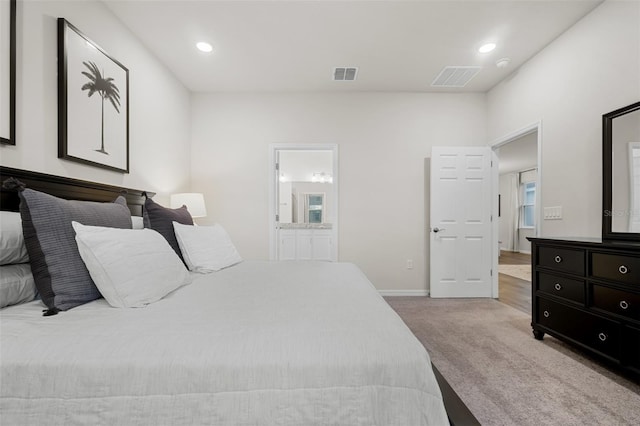 carpeted bedroom with recessed lighting, visible vents, baseboards, and connected bathroom