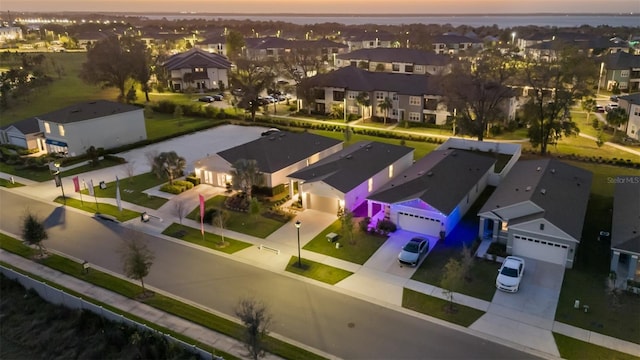 birds eye view of property with a residential view