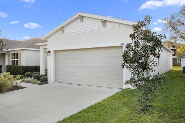 single story home featuring driveway, an attached garage, a shingled roof, stucco siding, and a front lawn