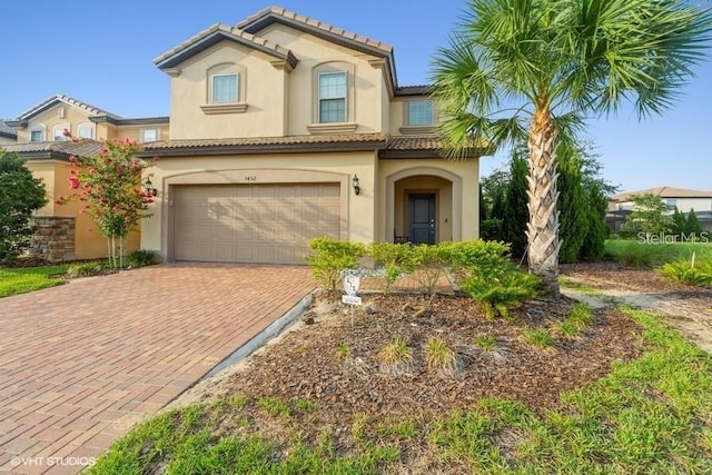 5452 Misty Oak Cir, Davenport, FL 33837 - mediterranean / spanish home featuring a garage