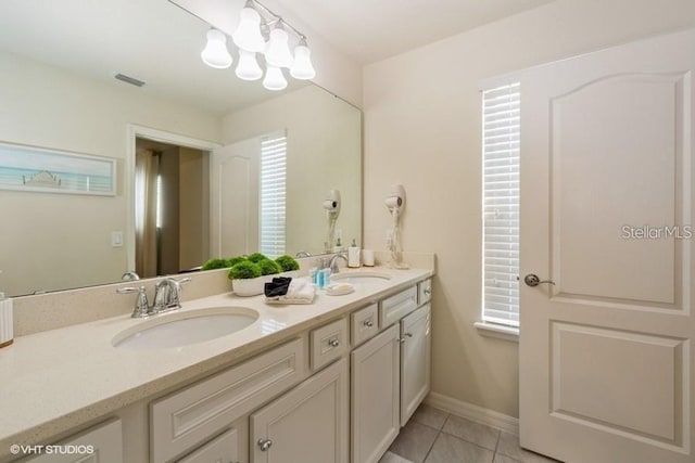 bathroom with tile patterned flooring and vanity