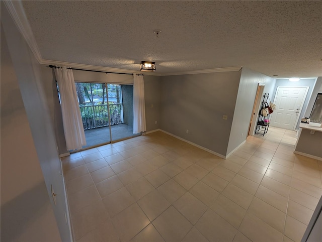 unfurnished room featuring crown molding, a textured ceiling, and light tile patterned floors